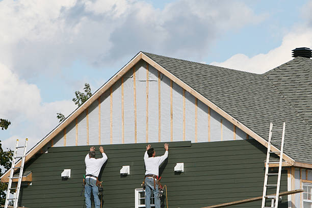 Professional Siding Installation technician working in Louisville, TN
